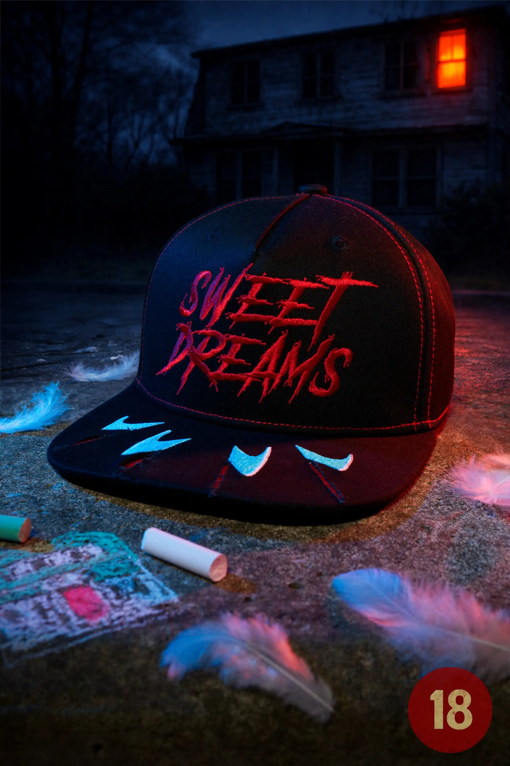 Black horror baseball cap embroidered with “Sweet Dreams” text and claw-mark details. Photographed at night outside a spooky house.