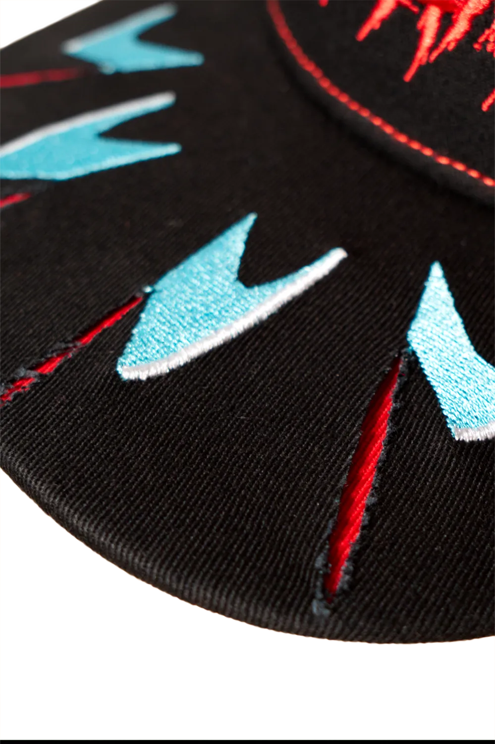 Close-up of Freddy Krueger claw-mark detailing stitched into the brim of the Sweet Dreams horror cap